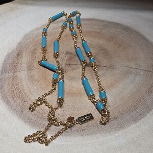 Kate Spade gold-tone necklace featuring turquoise or aqua blue enamel tube beads